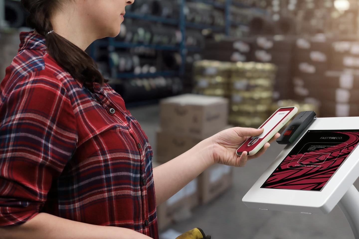 Person using reader in warehouse 