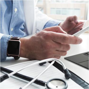 Doctor checking phone